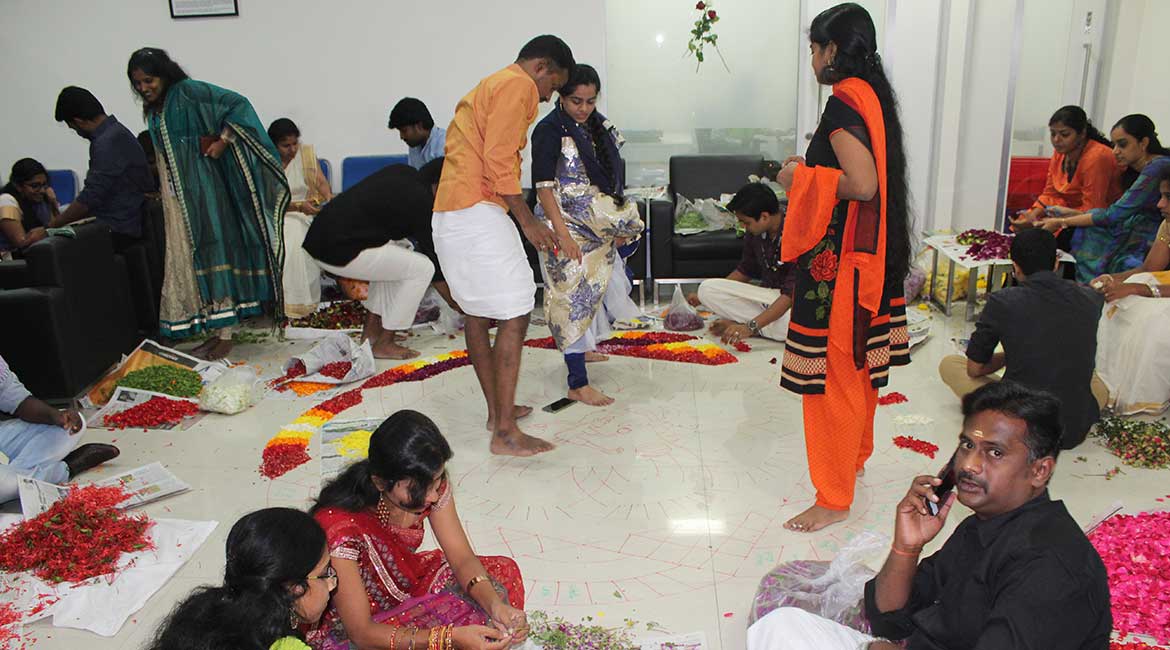 Busy with Onam Pookalam